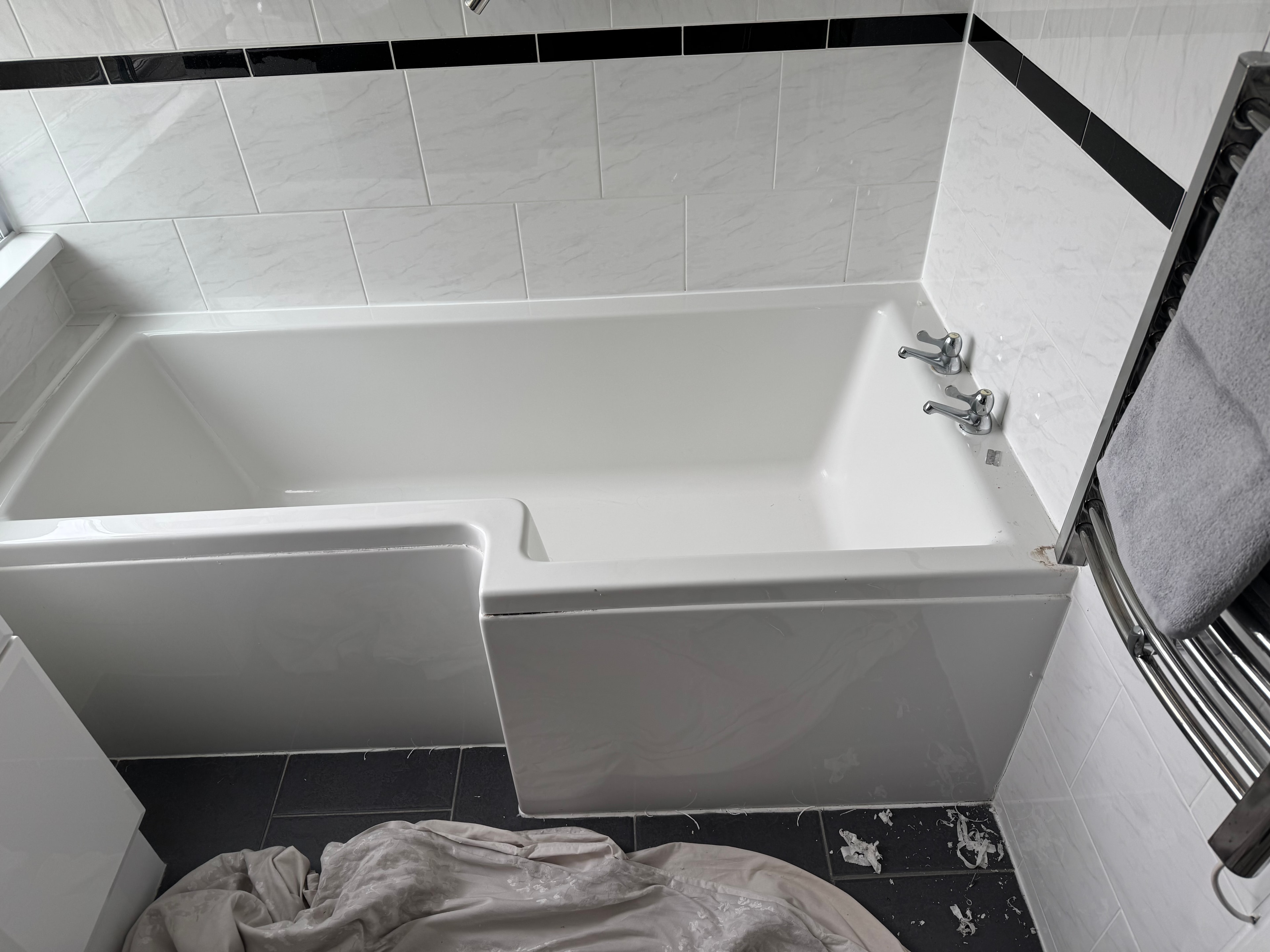 White bath ready to remove and fit large shower tray and screen