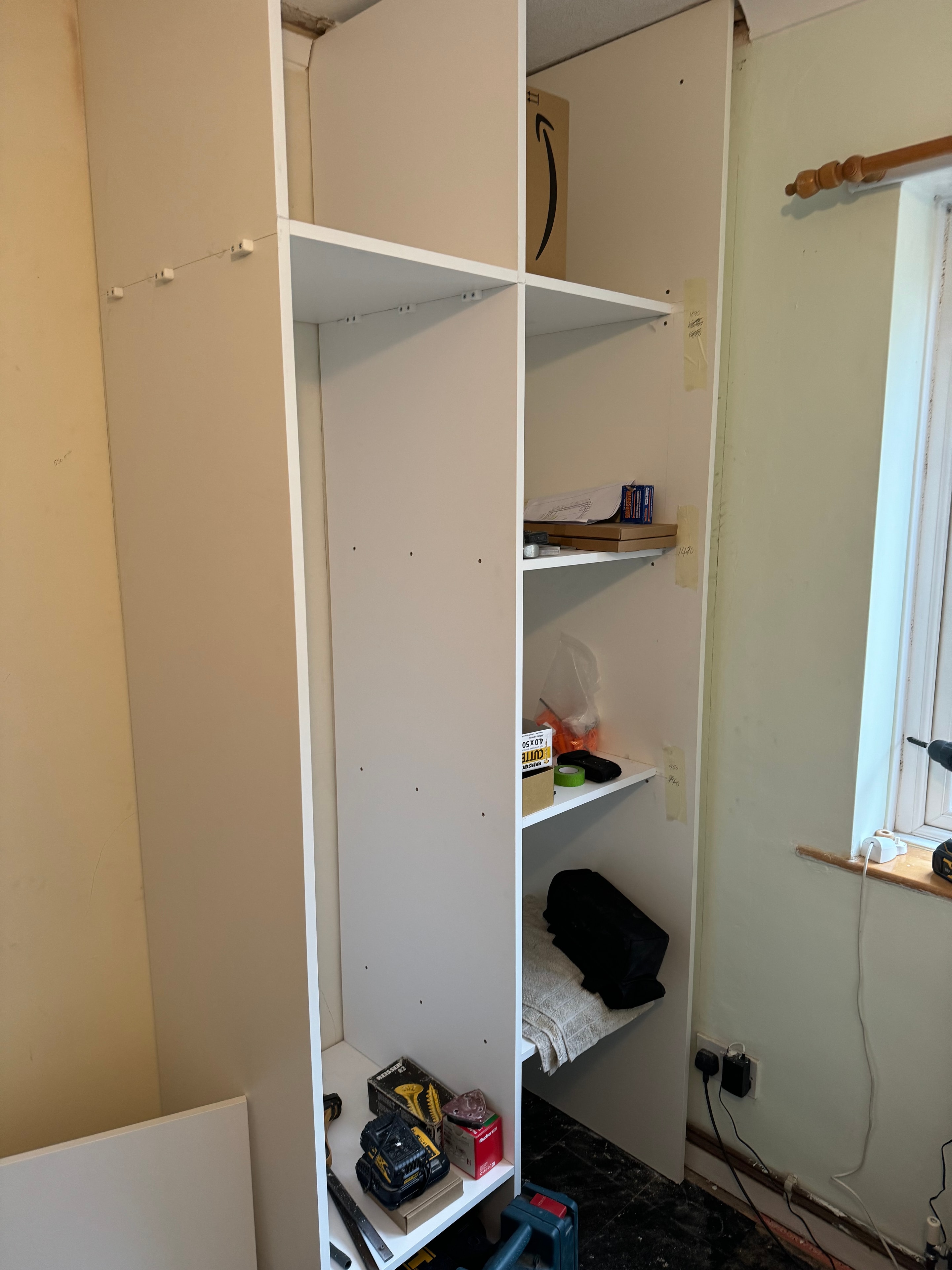Bespoke wardrobe carcass being built and fitted