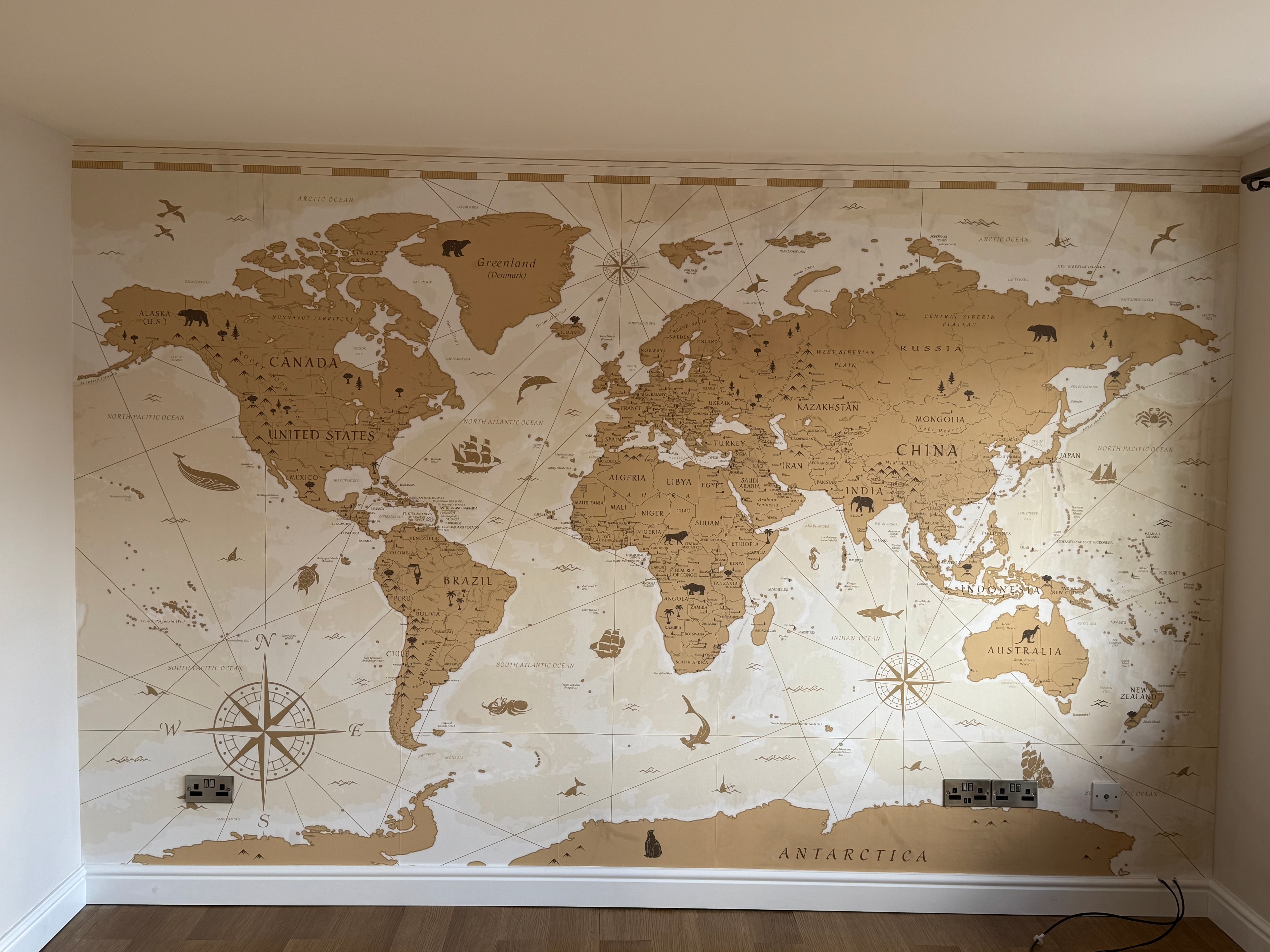 Completed world map feature wall mural — close-up detail